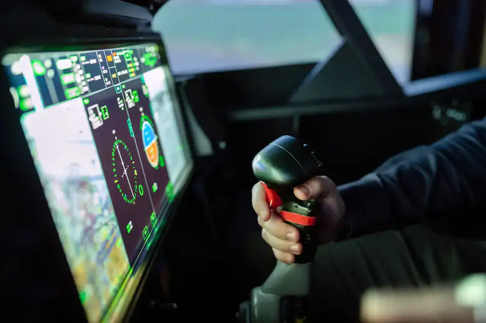 Champion pilot holding virtual trophy in simulator setup