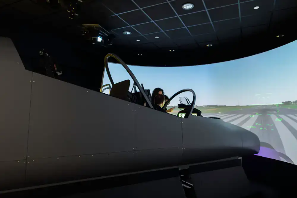 High-end home flight simulator rig in a dark room